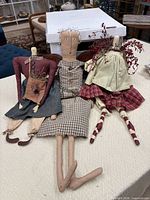 All three primitive rag dolls arranged on table