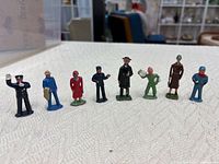 Front view of all eight painted Barclay figurines