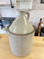 Full view of stoneware jug showing shape, handle and glaze