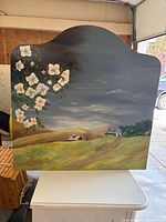 Full view of arched headboard showing entire painted countryside scene
