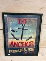 Front view of framed anchor and seagull print