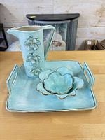 Full view of tray, bowl, and pitcher showing color and design