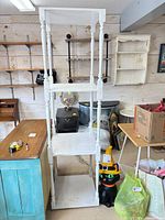 front view of full height white wooden display rack