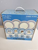 Front of boxed Oneida Kitchen Snow Fairies 12-piece place setting