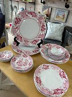 Full 20-piece set arranged on table showing variety of plates, bowls, platters