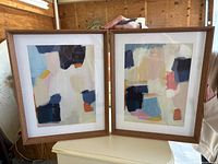 Front view of both framed abstract prints