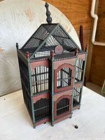 Three-quarter view showing painted trim, roof design and overall structure