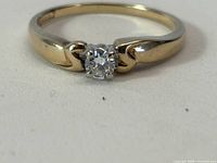 Top view of 14kt gold solitaire ring with round diamond