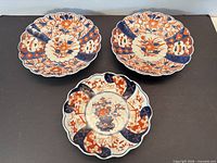Three Imari plates, full view