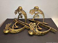 Overview of all four brass brackets