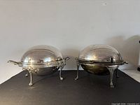 Both domed silver plated dishes side by side