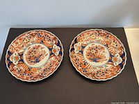 Two matching Imari plates side by side