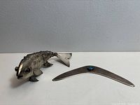 Articulated sterling fish and boomerang together