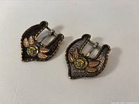 Both sterling overlaid belt buckles front view