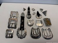 All 20 alpaca buckle and bolo tie parts on white background
