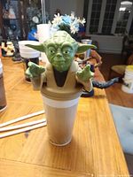 Yoda topper attached to cup full view