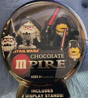 Front view of sealed package showing both figures and branding