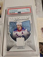 Jacob Trouba NHL Remnants jersey relic card in PSA slab