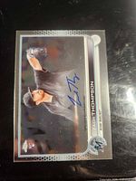Front of autographed 2022 Topps Chrome Zach Thompson rookie card
