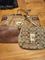 Front view showing both Coach crossbody and Nine West tote