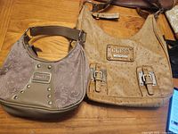 Both handbags side by side displaying size, color and front details