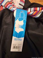 Krista tag showing size 18W and waist minimizer feature
