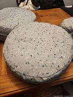 Top view showing speckled pattern and round shape