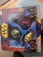 Front of gift set showing Darth Vader, Yoda head, C-3PO head ornaments in window box