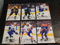 All six sleeved Young Guns cards displayed