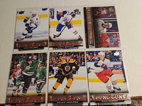 Front view of all six sleeved Upper Deck Young Guns hockey cards
