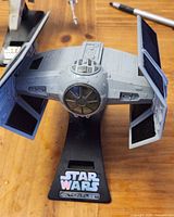 Front view of TIE Fighter on display stand