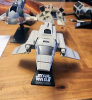 Front view of shuttle on stand showing cockpit and cannons