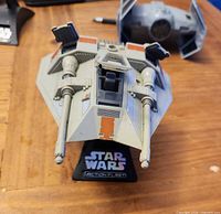 Snowspeeder on Action Fleet stand, laser cannons, cockpit and engine hatches visible