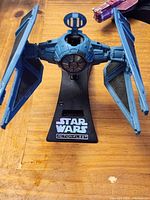 Front view of TIE Fighter on stand
