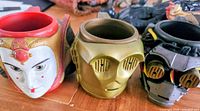Three character head mugs side by side: Queen Amidala, C-3PO, Destroyer Droid