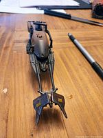 Front view of brown and black 74-Z Speeder Bike showing nose and steering vanes
