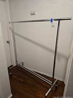 Full view of chrome garment rack assembled in hallway