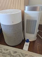 BlueAir air purifier beside Dreo space heater showing full units