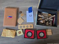 Group shot of entire lot with book, box, coins, flatware