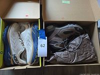 Open boxes showing Hoka running shoes and Vasque Gore-Tex boots