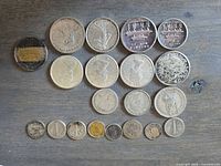 Full lot of 19 coins on tabletop