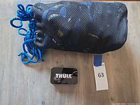 Mesh bag, closed Thule tin