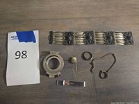 All five sterling items laid out: bracelet, pendant, ring, chain, tie clip