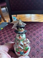 Front view snowman ornament with tag visible