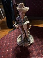 Front view bearded man in hat playing accordion