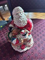 front view of ceramic Santa figurine with toy sack