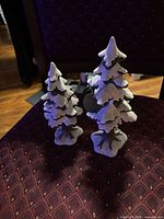 Both ceramic trees front view on chair