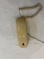 Front view handset on base, coiled cord visible