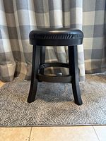 Stool front view showing legs and seat