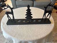 Front view showing reindeer, tree motif and tealight positions